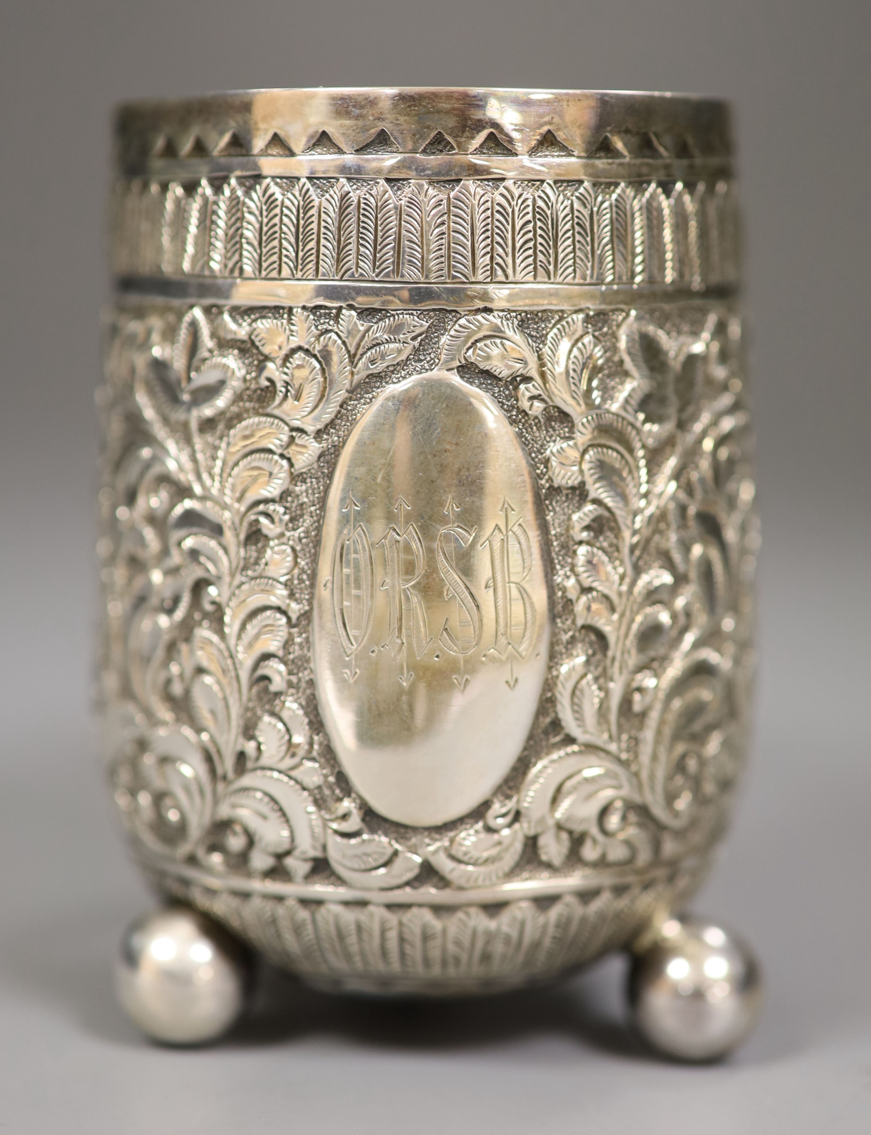 A cased Victorian embossed silver christening cup, Charles Boyton II, London, 1887, 93mm, 4oz.